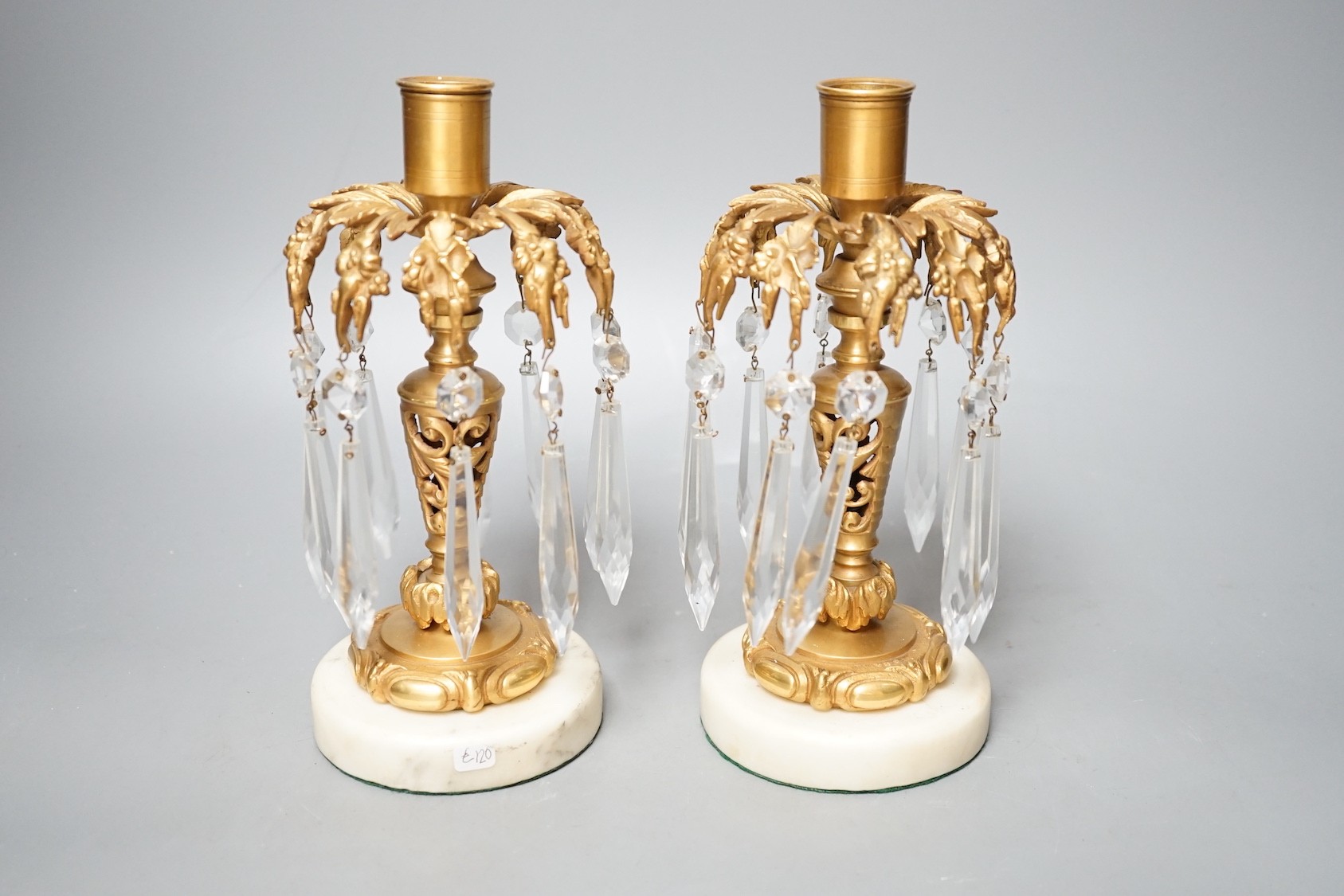 A pair of gilt metal and glass lustre drop candlesticks - 22cm tall